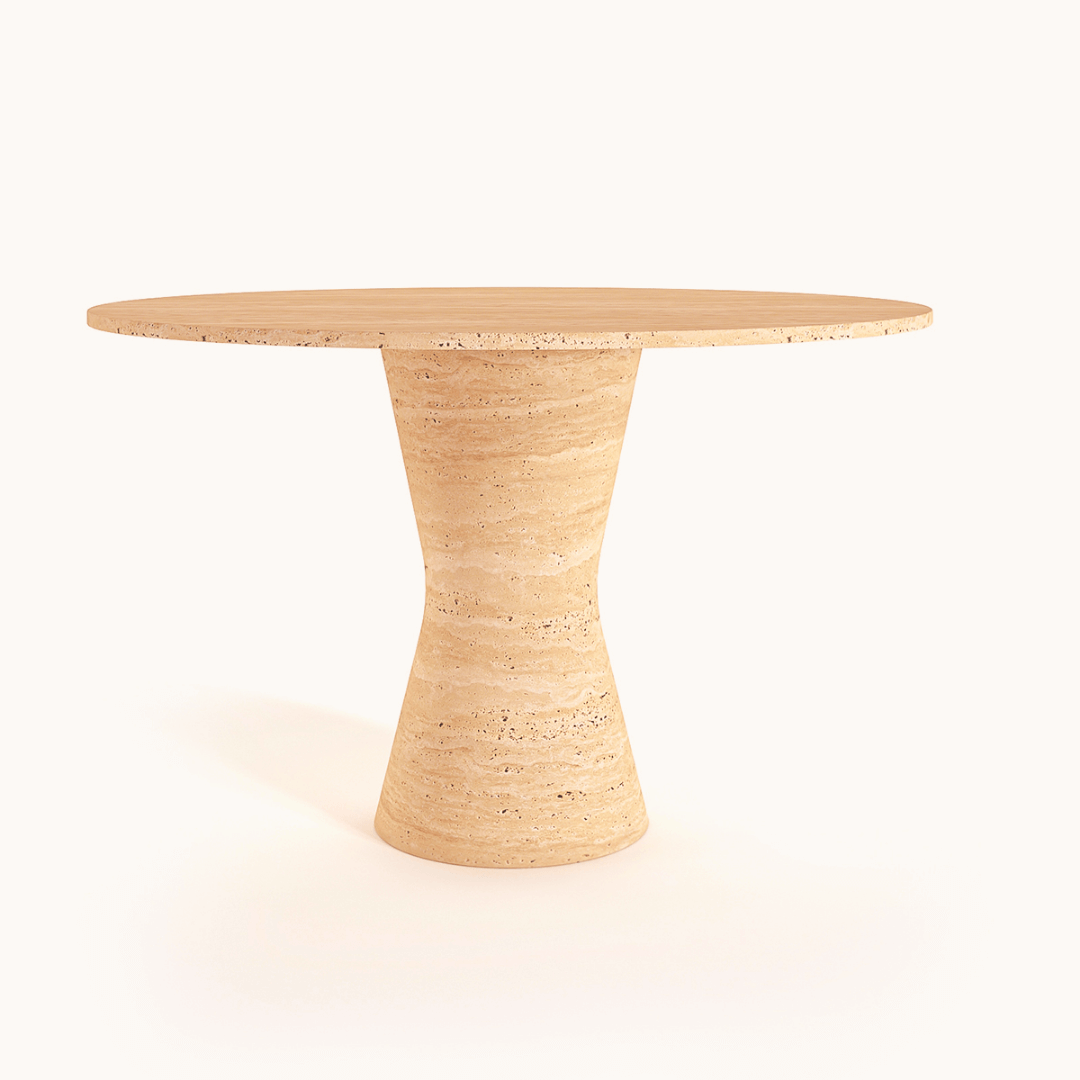 The Travertable Lunar Surface Round Travertine Dining Table boasts a round wooden top with a smooth, curved pedestal base on a light background. Its natural wood finish highlights the grain and texture, adding contemporary elegance to any dining area.