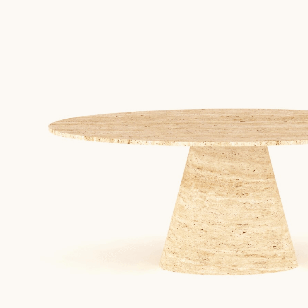The Olympian Ellipse Travertine Table by Travertable showcases a seamless design with a ribbed pedestal base, crafted entirely from light beige travertine. Set against an off-white background, this elegant piece exudes sophistication.