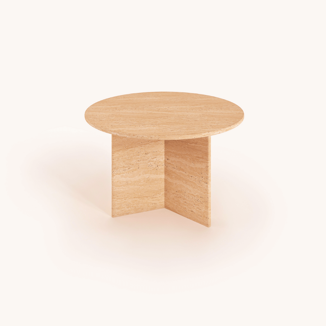 The Contemporary Round Travertine Table by Travertable embodies natural elegance with its minimalist design, featuring a light wood tabletop and an intersecting base for sturdy support—a modern design masterpiece on a plain, light background.
