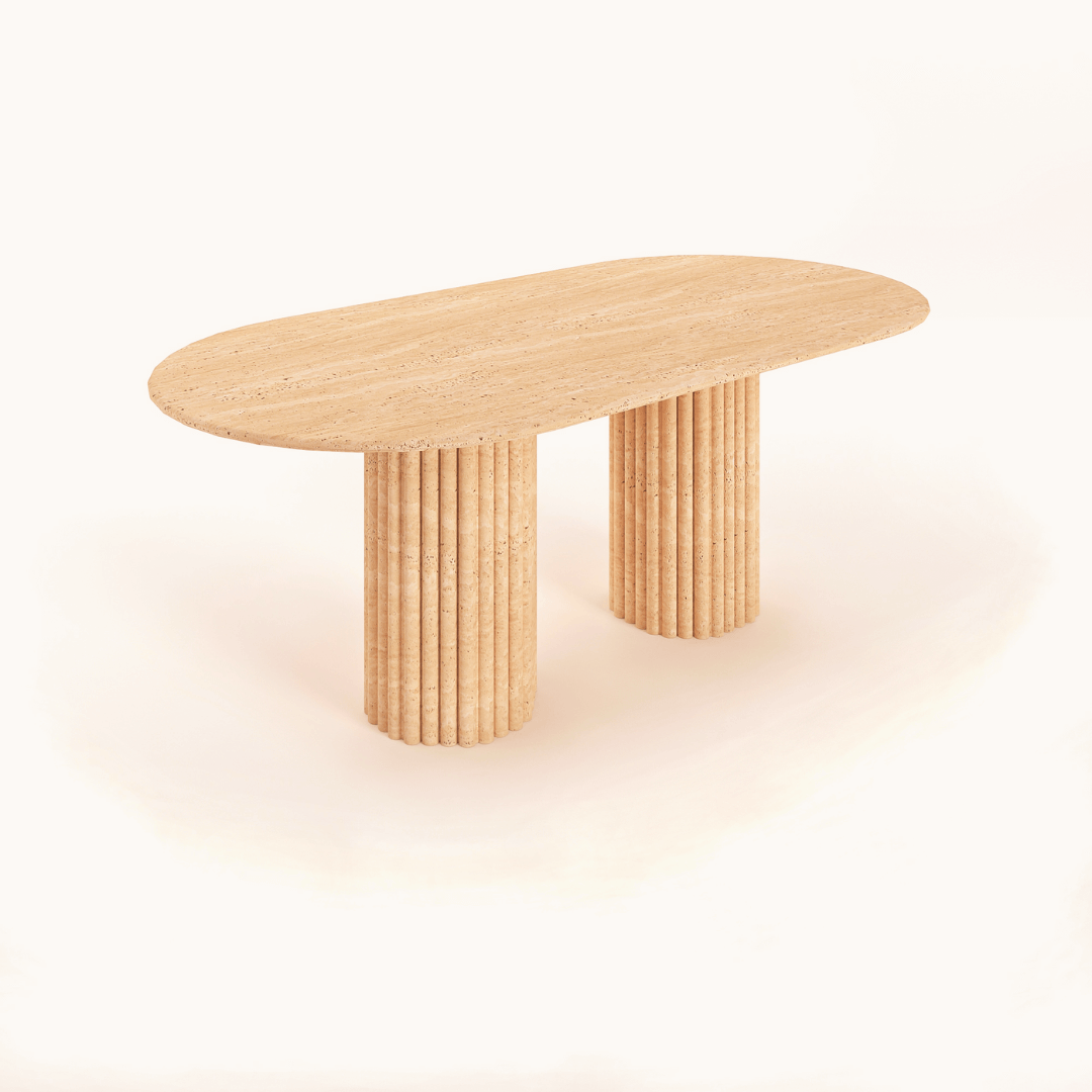 The Travertable Elegant Dual Pillar Dining Table features a modern, minimalistic light wood design with an oval top and two cylindrical fluted legs, enhancing its natural elegance similar to a travertine texture.