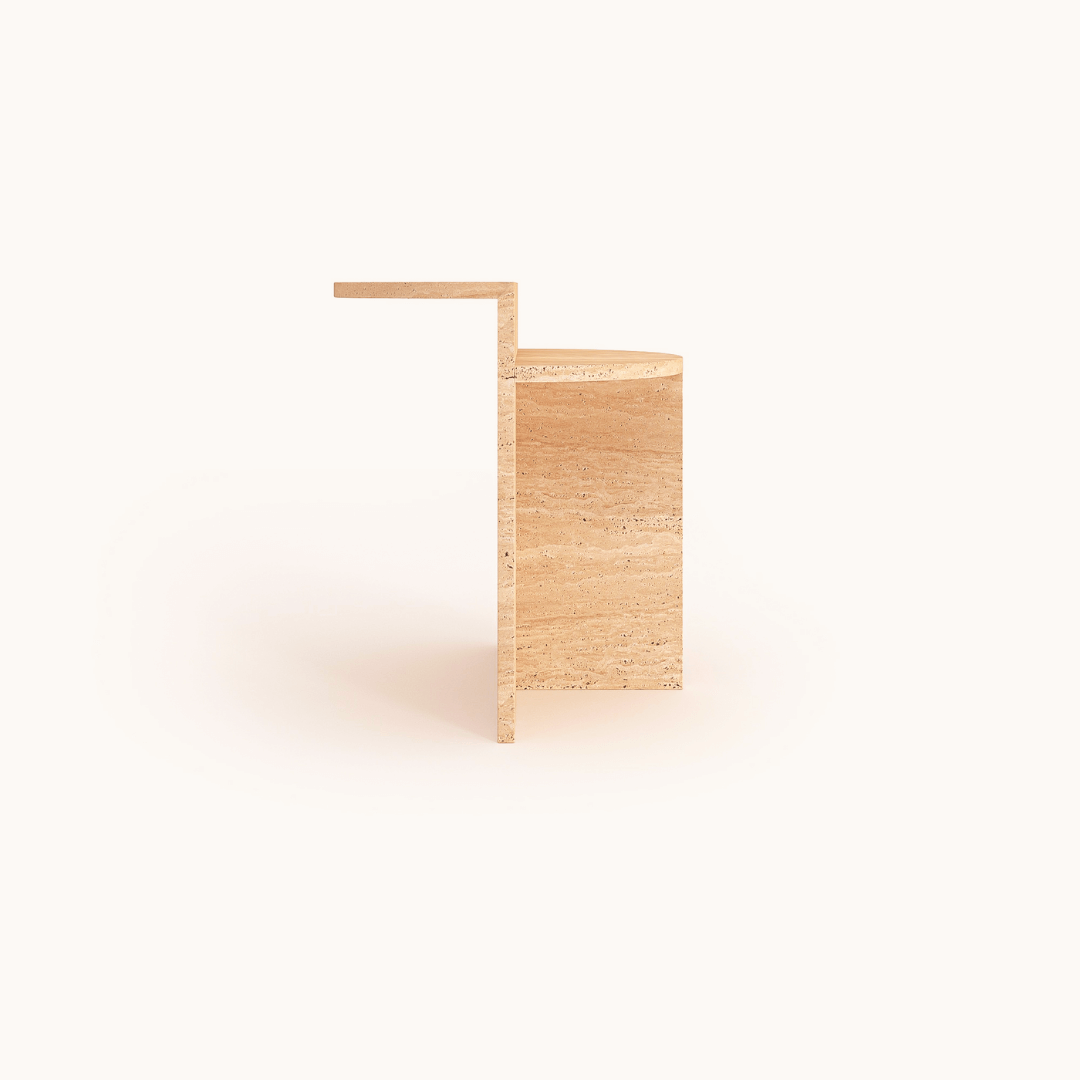 A minimalistic wooden chair with a flat, cantilevered seat and a solid block base is paired with the Classic Travertine Accent Table by Travertable. The design is clean and modern, set against a simple, neutral background.