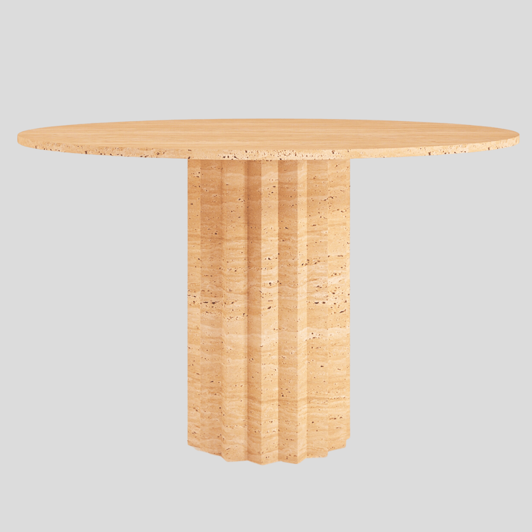 The Fluted Round Travertine Dining Table by Travertable stands gracefully against a plain, light gray background, featuring a smooth top and textured, fluted pedestal base that echoes modern travertine marble elegance.