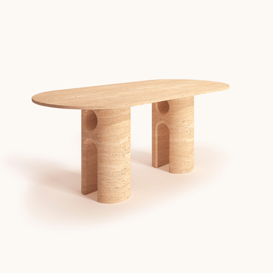 The Travertine Majesty Ellipse Table by Travertable is a modern wooden dining table with an oval travertine top and dual cylindrical supports, featuring smooth edges and a light wood finish. Set against a white background, it offers customizable options to fit any dining space seamlessly.