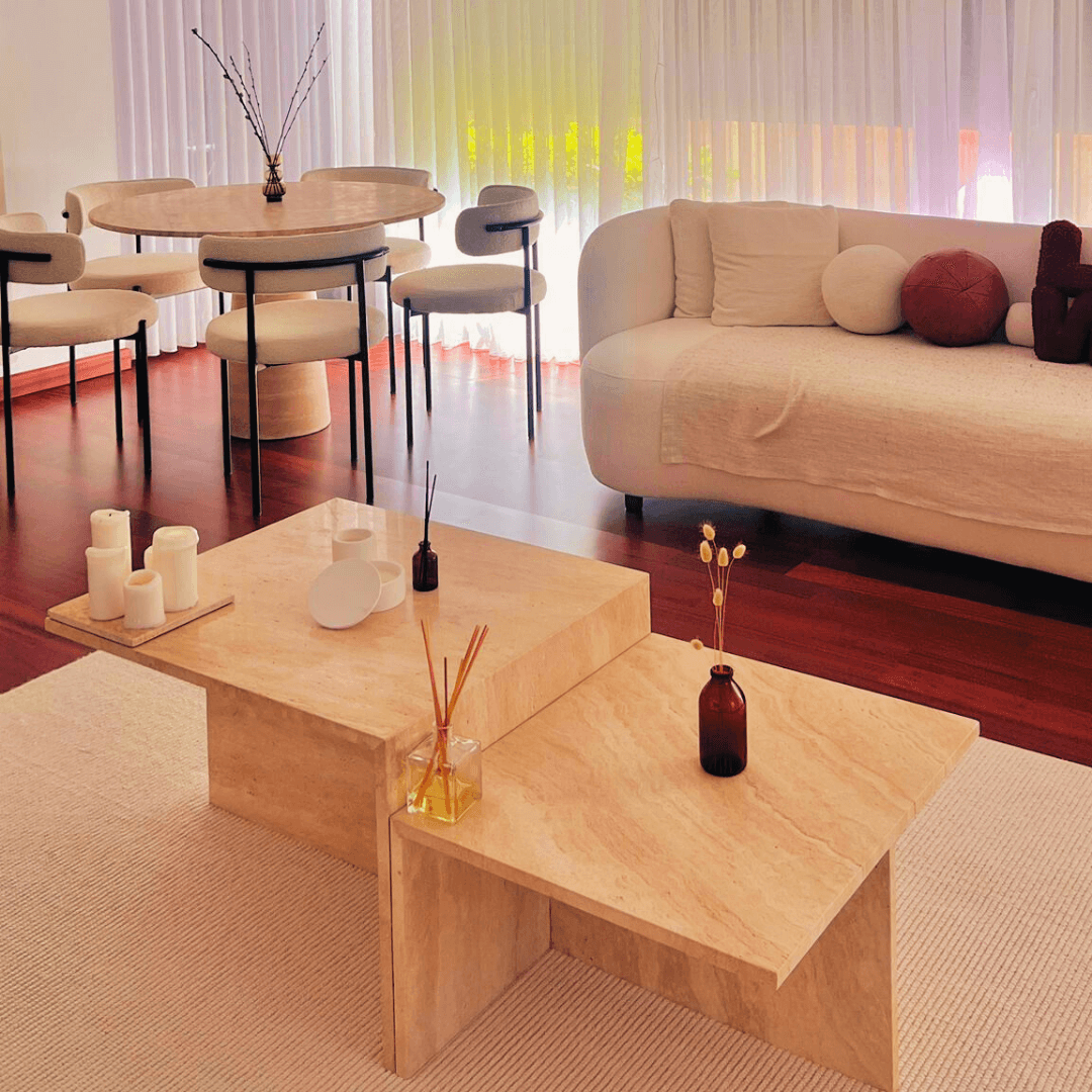 travertine coffee table in customer home. travertine dining table in the background