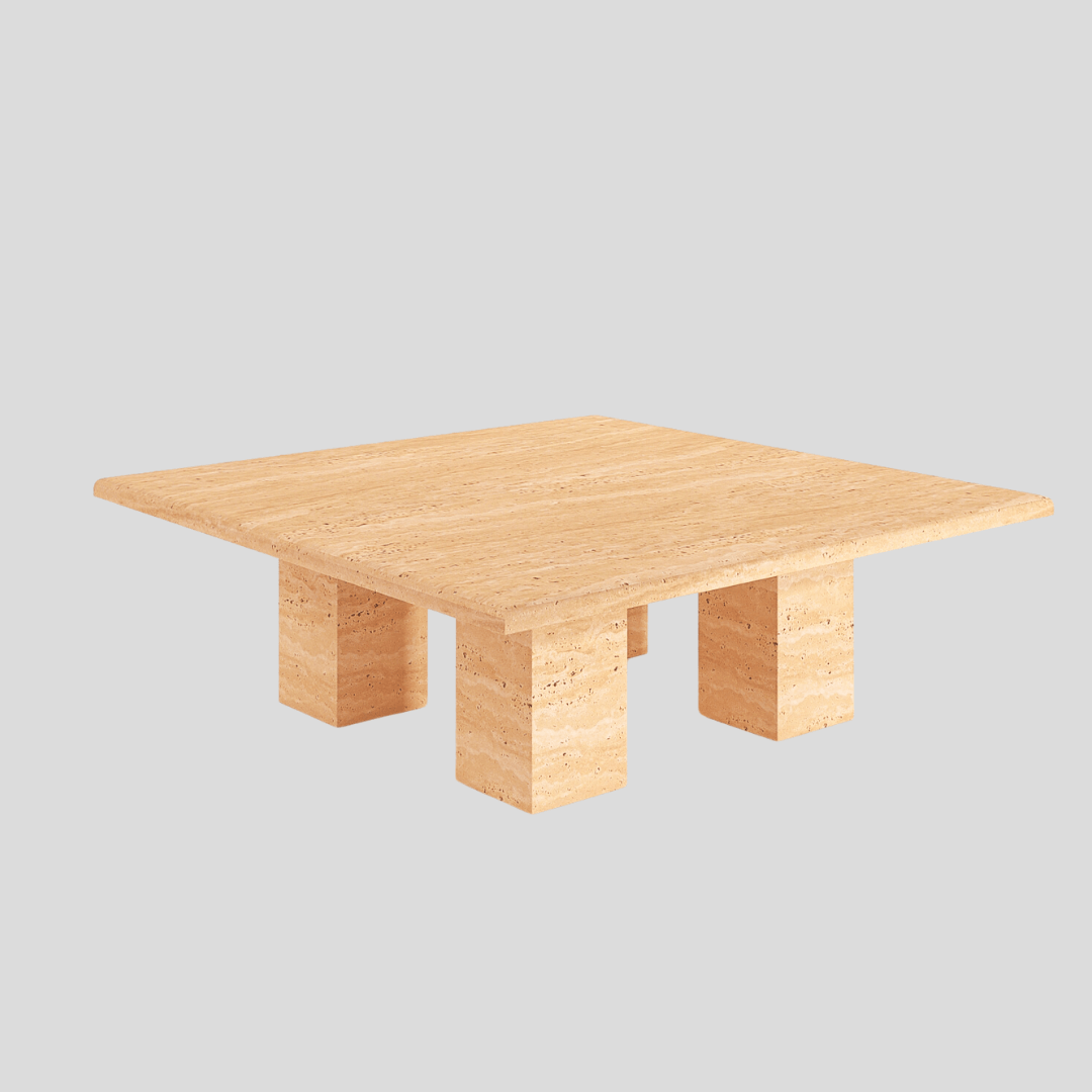The Pebble Path Travertine Coffee Table by Travertable features a timeless design with a fluid, light beige stone finish. This elegant piece showcases the natural beauty of its thick tabletop, supported by four solid, rectangular legs against a light gray background.