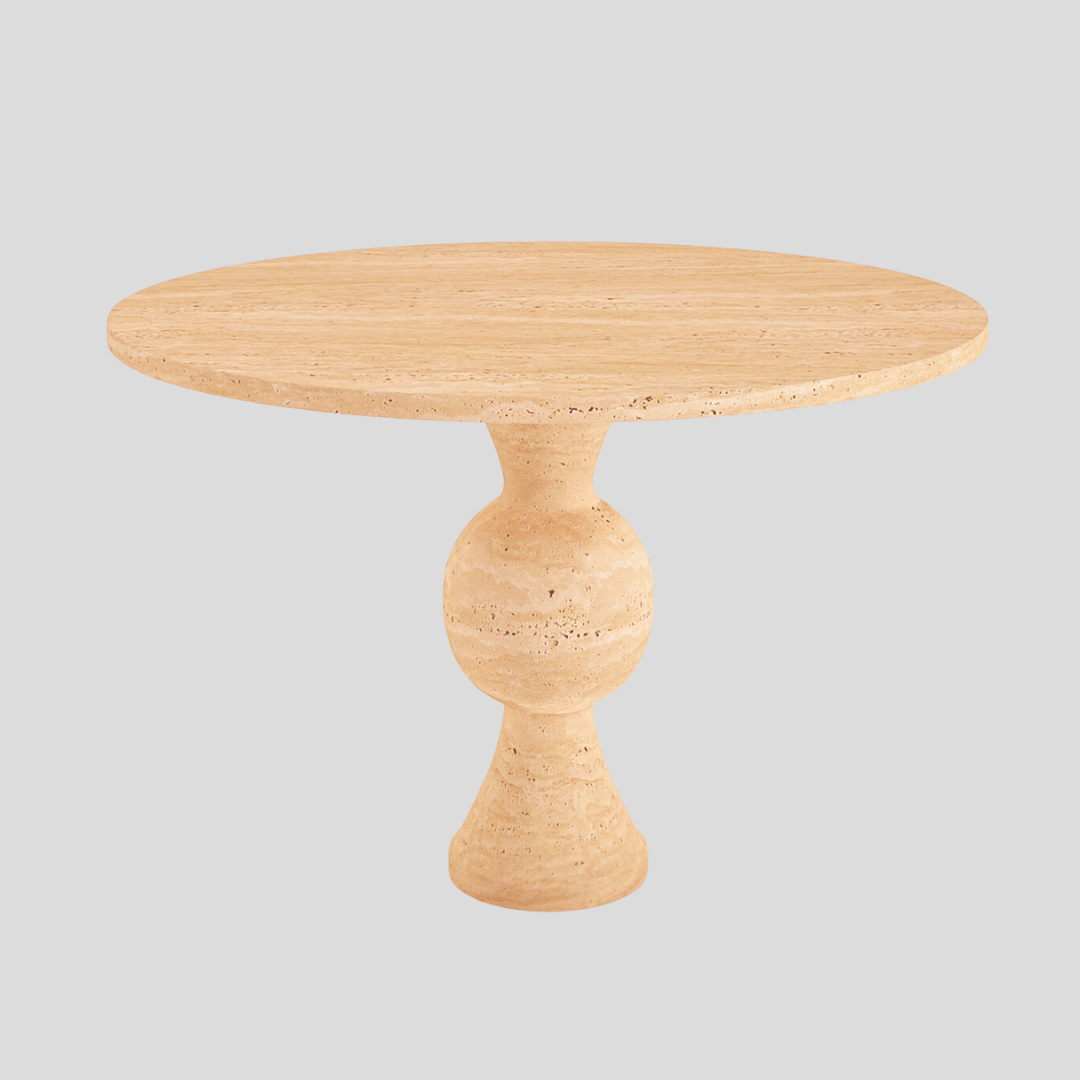 The Hourglass Round Travertine Dining Table by Travertable showcases a smooth, beige stone surface and features a central sculptural base resembling a large, hourglass-like sphere, elegantly set against a plain gray backdrop.