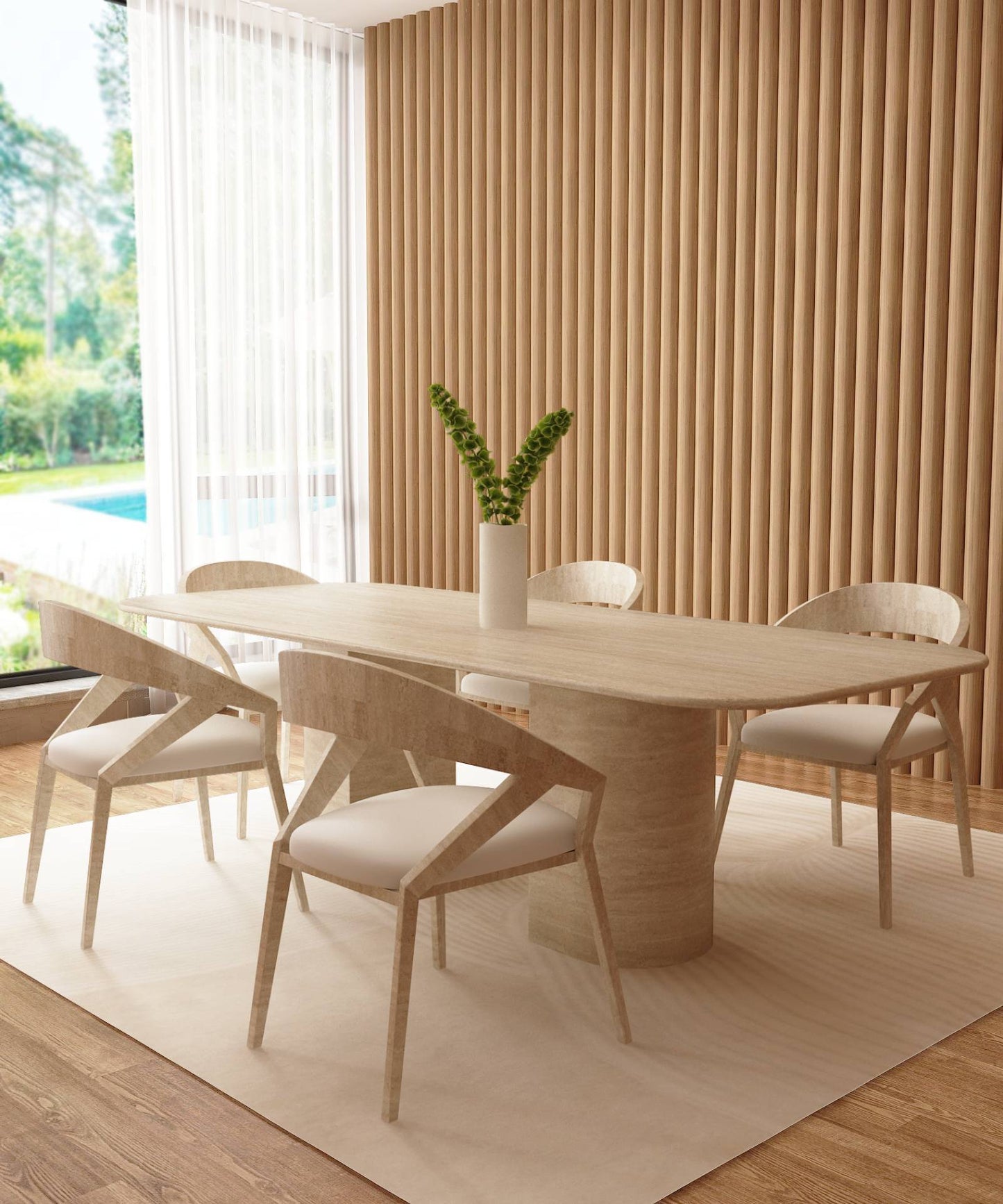 A modern dining room showcases the TRAVERTABLE Rectangular Travertine Dining Table with a natural stone base, five matching chairs, a white vase with greenery, beige rug, wood-paneled walls, and large windows overlooking a pool and lush landscape.