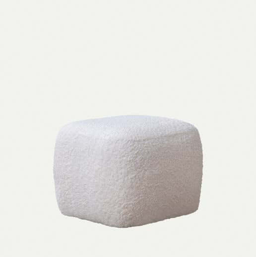 The Cloud Plush Rocking Chair and Ottoman by Travertable features a white, textured square ottoman with rounded edges against a plain background, enhancing the cozy allure of the accompanying plush chair.