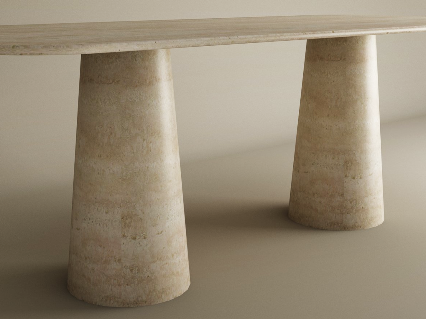 The TRAVERTABLE Rectangular Travertine Dining Table features a natural stone top and an organic travertine stone base with two wide conical pedestal legs, creating a sophisticated look on a neutral background. Customizable to your style.