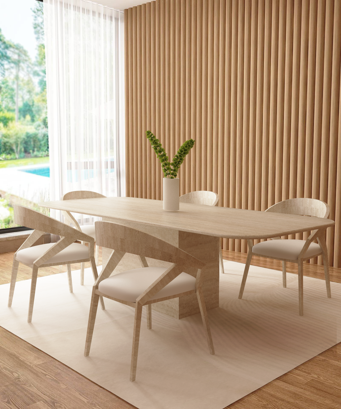 A modern dining room features the TRAVERTABLE Rectangular Travertine Dining Table with a natural stone base, four white chairs, a white vase with green foliage, vertical wooden slats on the wall, and large windows overlooking a garden and pool.