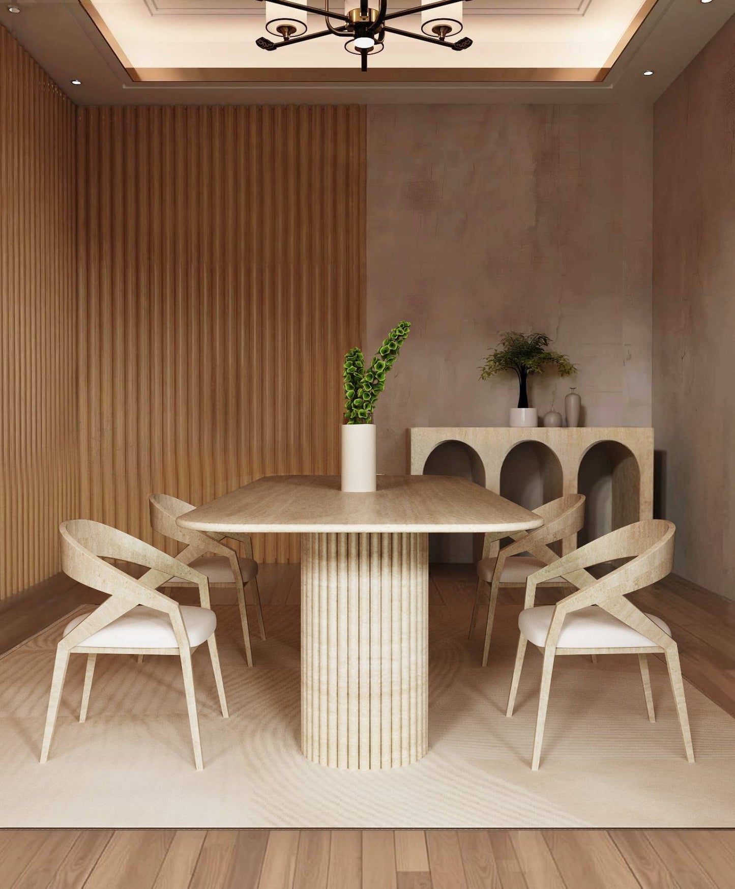 A modern dining room showcases the TRAVERTABLE Rectangular Travertine Dining Table with a vertical groove base, four chairs, a vase with greenery, and a sideboard—an organic stone heirloom piece set against wood and neutral walls.