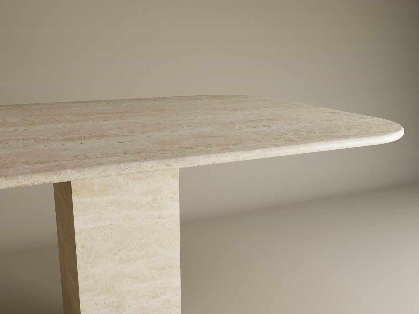 The TRAVERTABLE Rectangular Travertine Dining Table features a natural travertine stone top with rounded edges and a sturdy rectangular pedestal base, offering minimalist elegance. Customizable options are available.