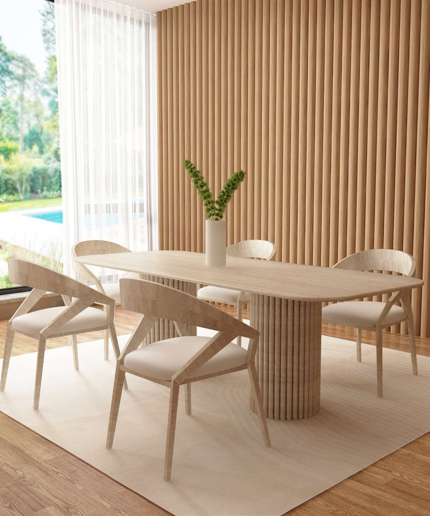 A modern dining room featuring the TRAVERTABLE Rectangular Travertine Dining Table with Vertical Groove Base, four matching chairs, a white vase with green stems, wood slat accent wall, large window with sheer curtains, and light rug on wooden floor.
