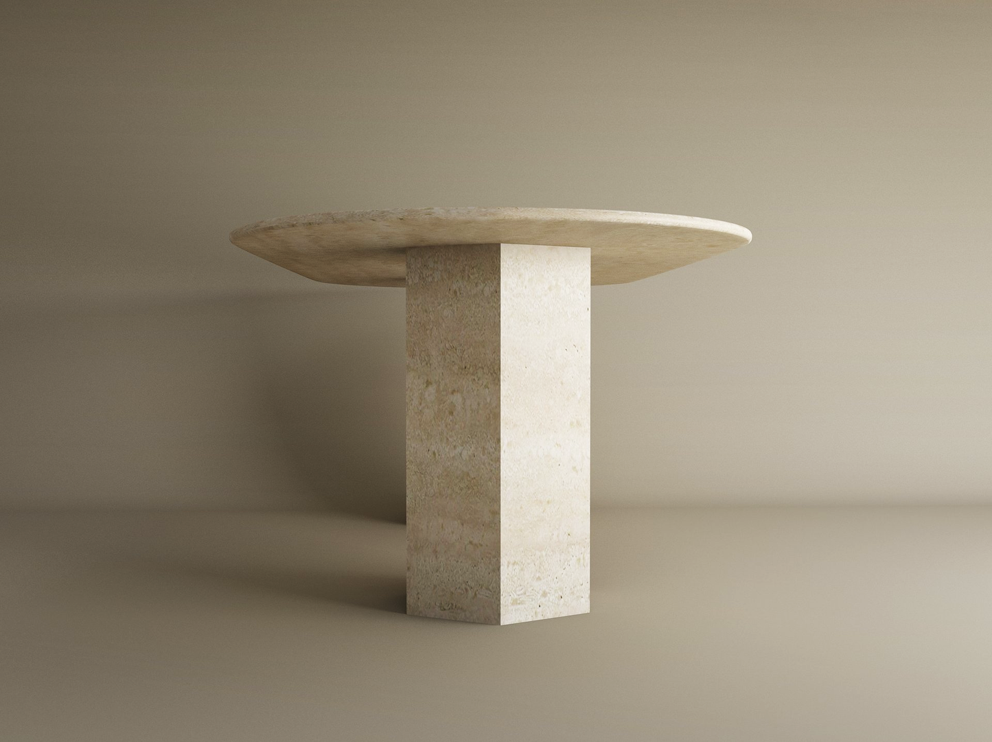 The TRAVERTABLE Oval Travertine Dining Table features a natural stone top and a hexagonal pedestal base, set against a neutral background. This customizable dining table combines organic style with elegant design.