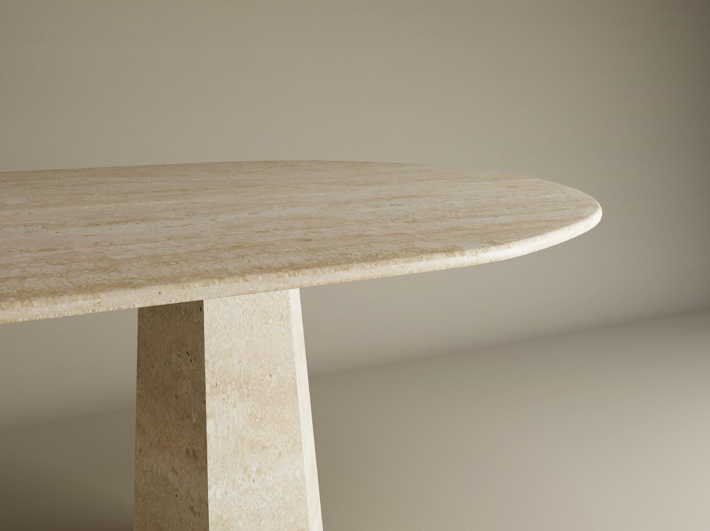 The TRAVERTABLE Oval Travertine Dining Table features a smooth, oval top and a solid tapered round travertine stone base. This minimalist, customizable piece adds elegance to any space with its light beige finish and sleek design.