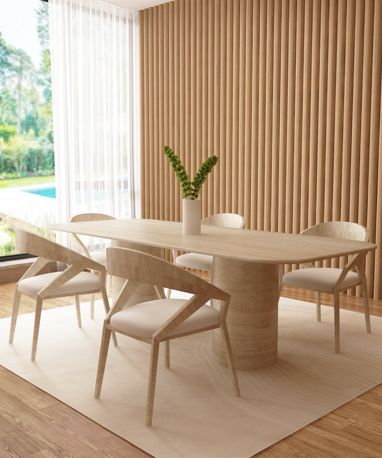 A modern dining room with a TRAVERTABLE Rectangular Travertine Dining Table with Smooth Cylinder Base, four chairs with white cushions, a tall green-leaf vase centerpiece, wood slat wall, large window, and neutral rug on wood flooring.