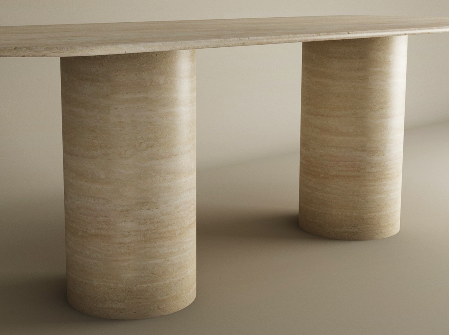 The TRAVERTABLE Rectangular Travertine Dining Table features a smooth, natural travertine top with rounded edges and two large cylindrical bases, all crafted from pure travertine stone. Customizable design completes this timeless, neutral centerpiece.