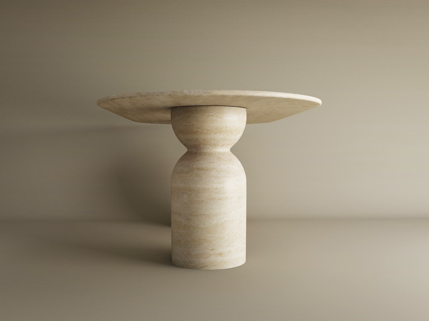 The TRAVERTABLE Oval Travertine Dining Table features a sculptural round organic stone base and natural stone tabletop, set against a plain beige background. Customizable design for minimalist dining spaces.