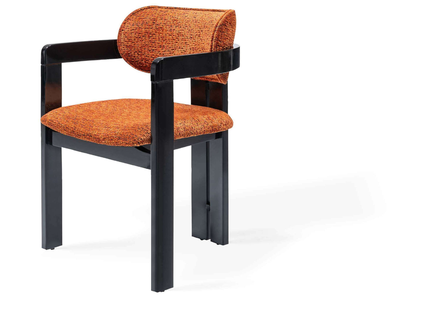 Discover the Solaris Retro Chair by Travertable, an ergonomic masterpiece with a black metal frame and an orange cushioned seat featuring a rounded backrest. Its sleek, minimalist design pops against a white backdrop.