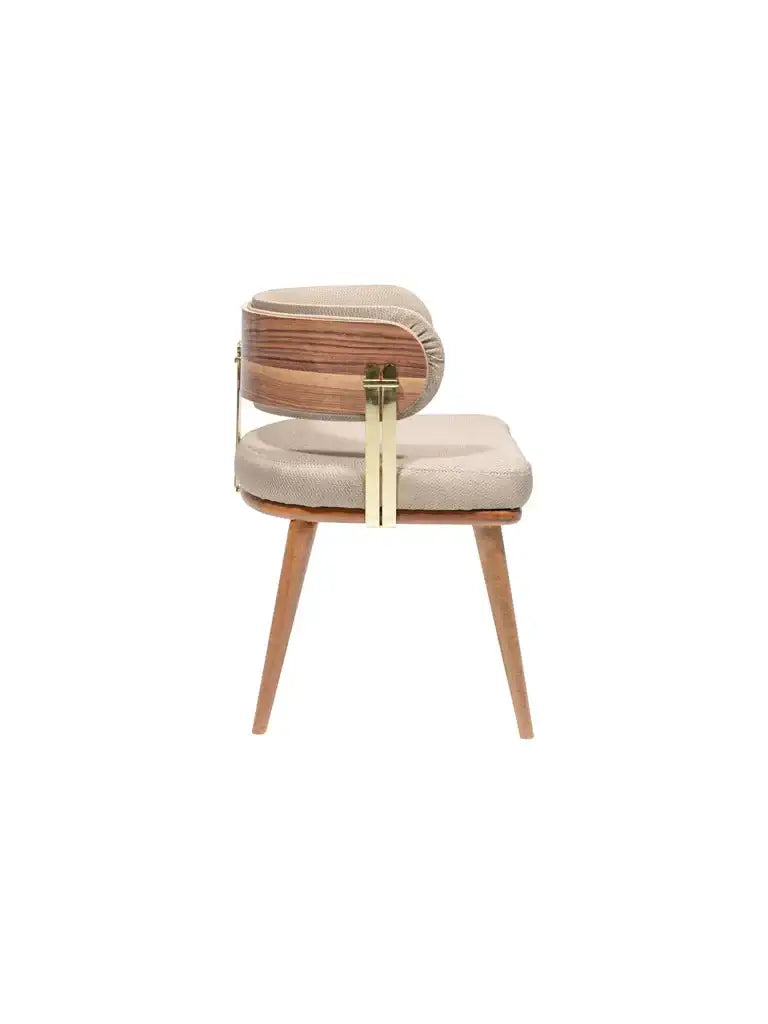 Side view of the Travertable Mid-Century Modern Walnut and Brass Chair showcasing light beige upholstery, a wooden backrest, angled wooden legs, and gold metal accents connecting the backrest to the seat.