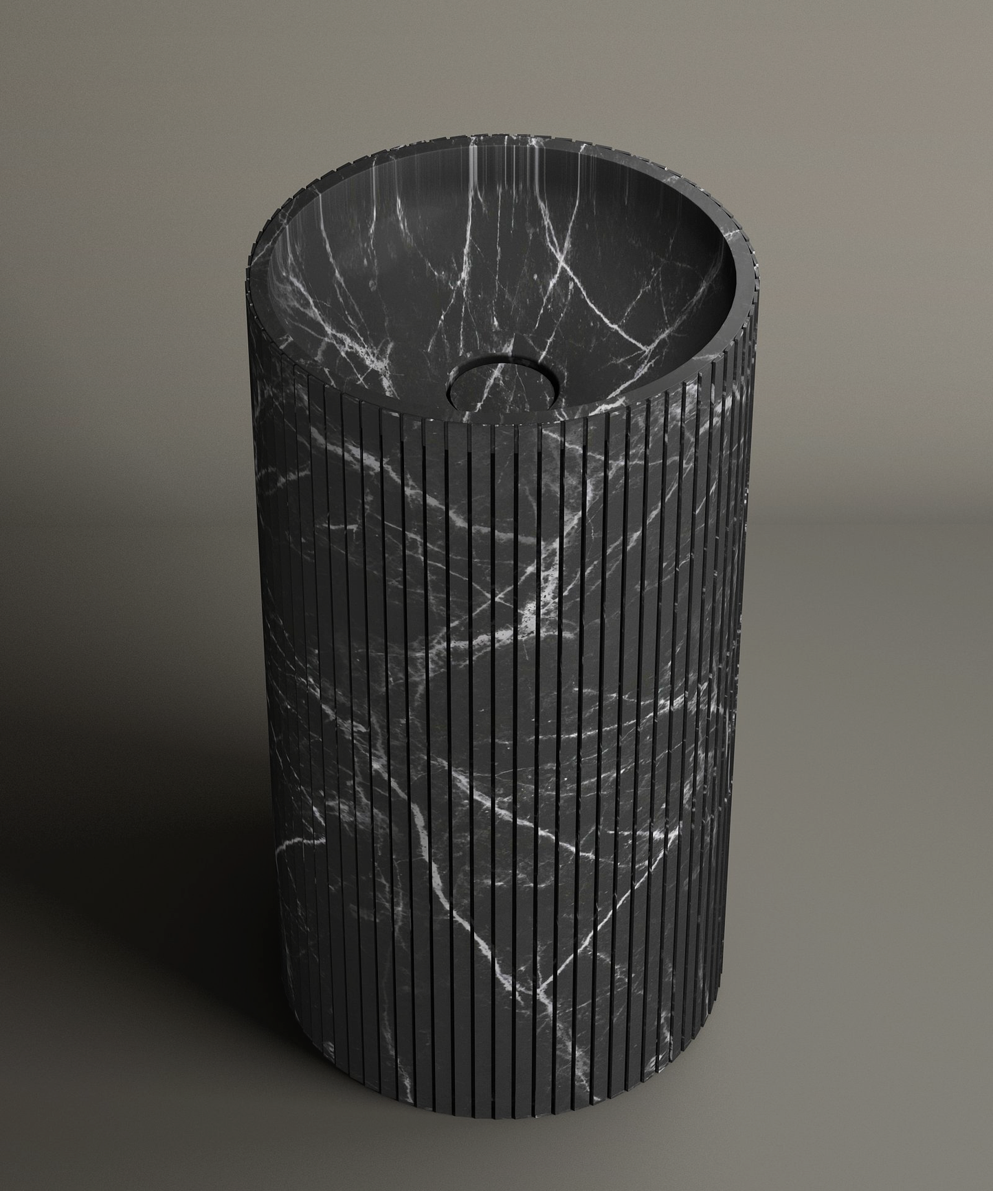 The TRAVERTABLE Nero Marquina Round Fluted Marble Pedestal Vanity Sink features striking white veining, a fluted grooved exterior, and a central drain hole—ideal for contemporary interiors.