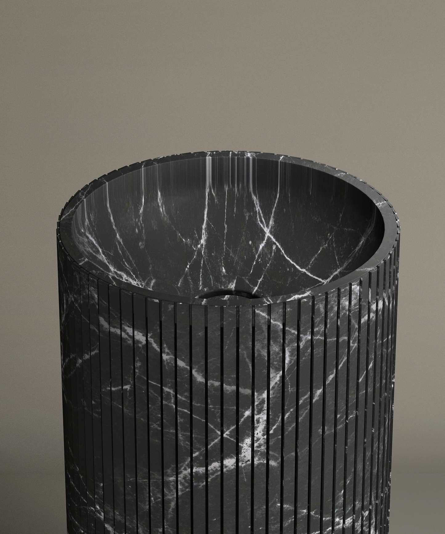 The TRAVERTABLE Nero Marquina Round Fluted Marble Pedestal Vanity Sink features black marble with white veining, fluted grooves, and a polished rounded basin—an elegant contemporary piece set against a beige background.