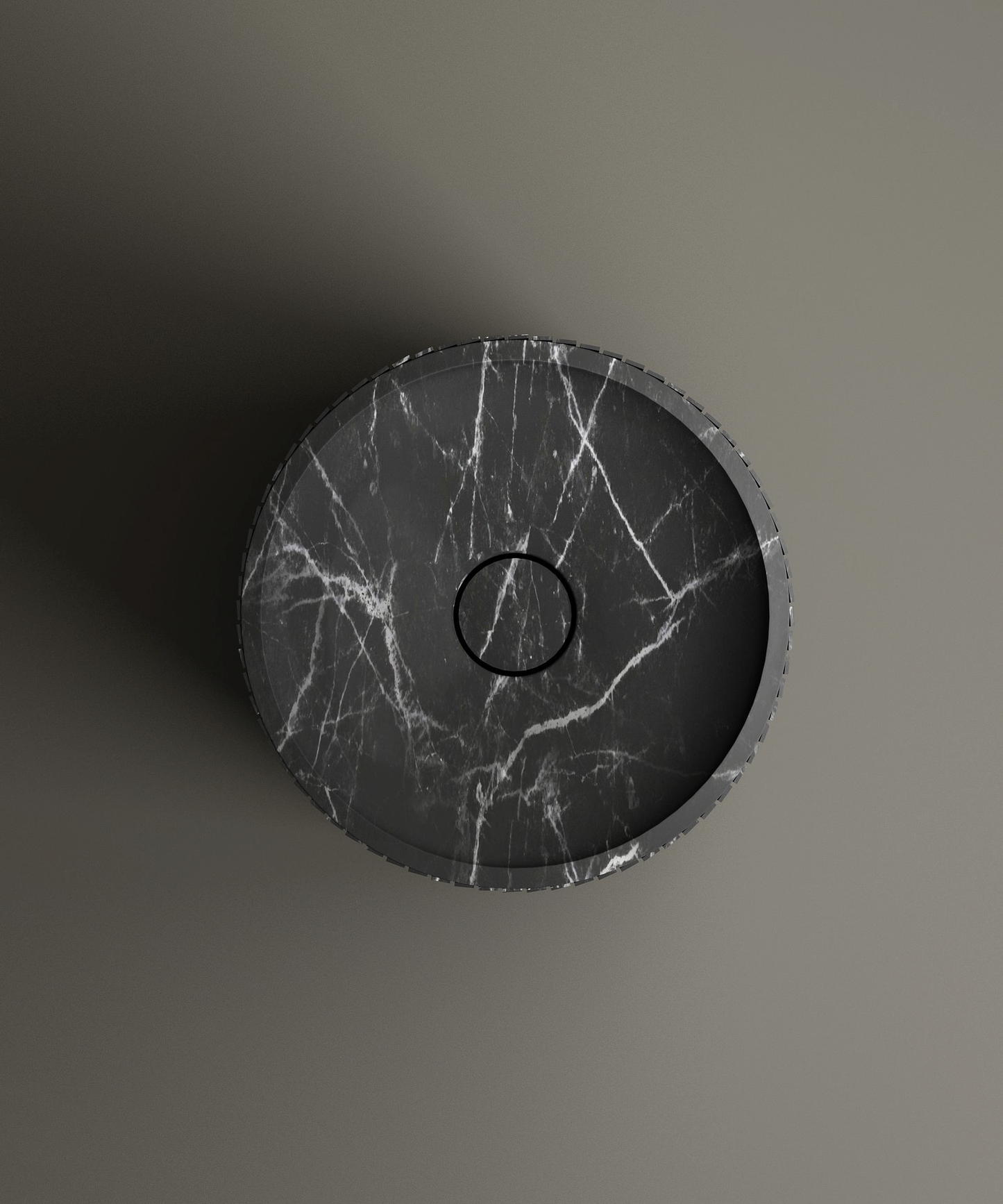 The TRAVERTABLE Nero Marquina Round Fluted Marble Pedestal Vanity Sink, shown from above with striking white veining and a central drain, stands out against a smooth gray background—ideal for contemporary interiors.
