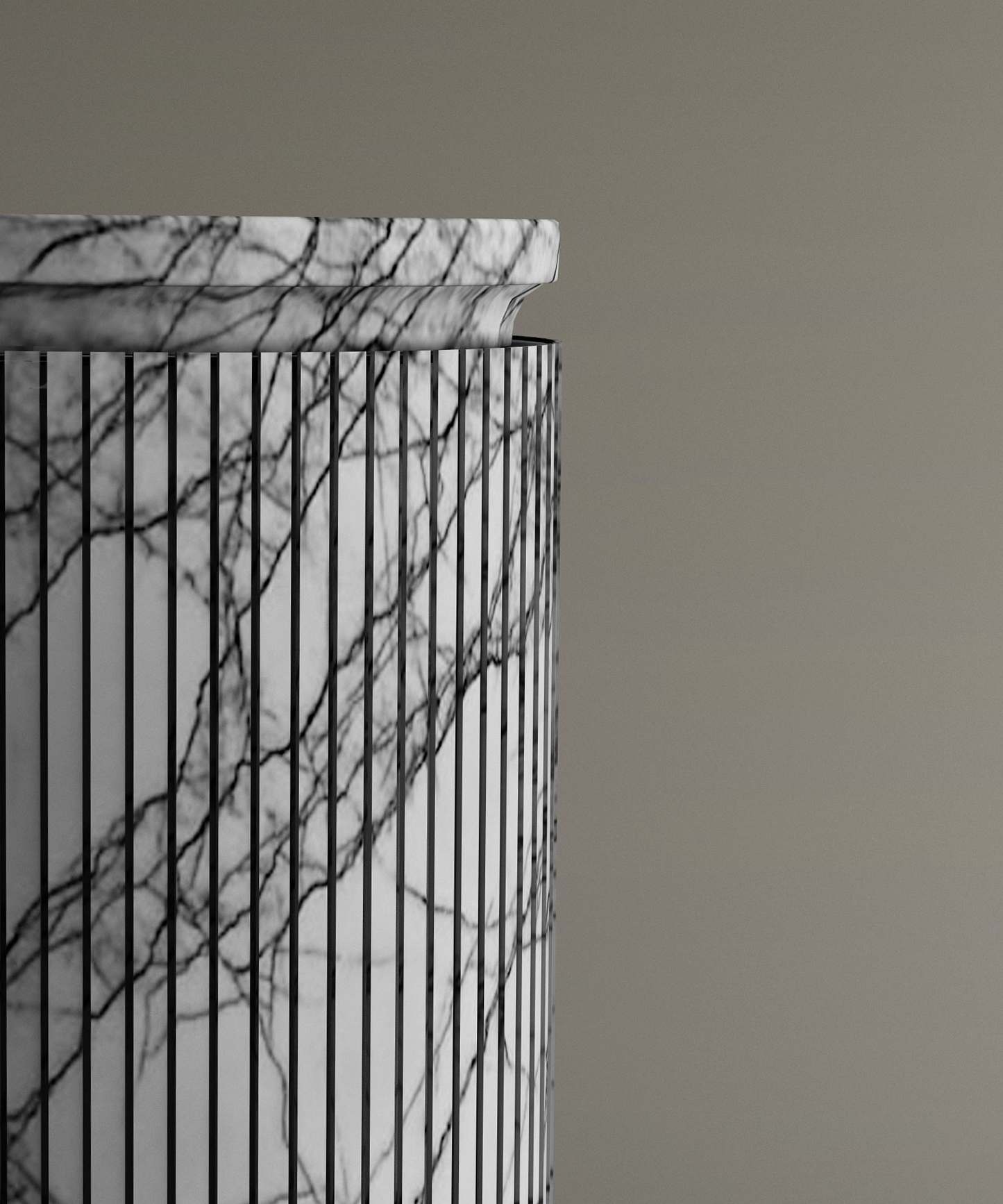 A close-up of the TRAVERTABLE Lilac Round Marble Pedestal Vanity Sink showcases its cylindrical form, vertical black lines, and natural gray veining against a plain beige background.