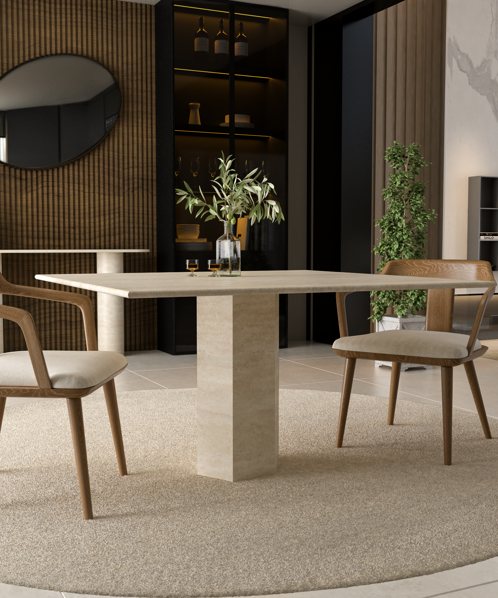 A modern dining room showcases the TRAVERTABLE Square Travertine Dining Table with Hexagonal Center Base, paired with two wooden chairs on a circular rug. A vase with greenery and glasses sit atop the table, with shelves, a round mirror, and a potted plant in the background.