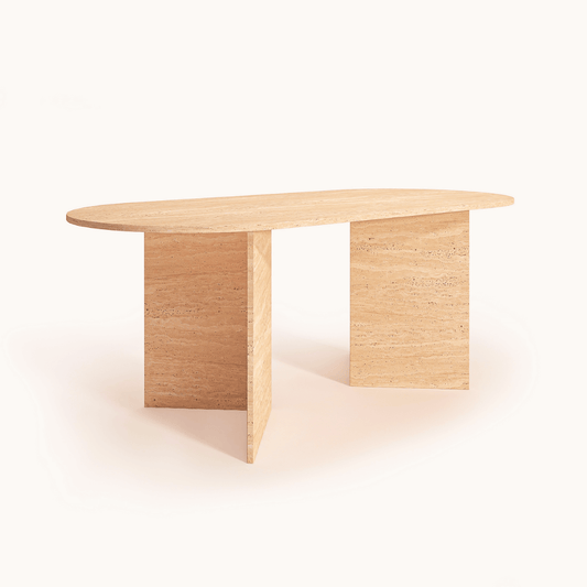 The Travertable V-Leg Travertine Dining Table is a minimalist piece with an oval top and two V-shaped legs, featuring a light, natural wood finish that showcases visible grain patterns.