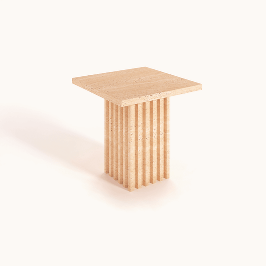 The Harmony Square Travertine Dining Table by Travertable features a unique fluted pedestal base against a light background. Its minimalist, modern design highlights the natural wood texture and offers customizable options to enhance your dining space.