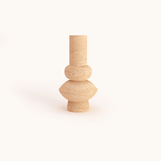 The Travertable Minimalist Beige Travertine Vase features a minimalist design with a tall cylindrical neck, rounded middle, and small circular base in unglazed travertine stone, all set against a plain white background.