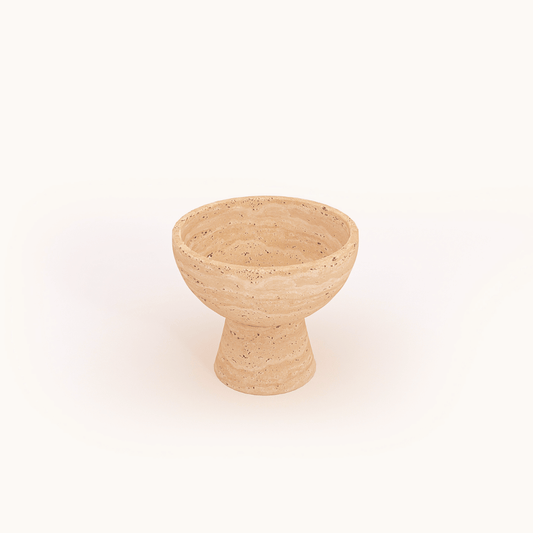 The Sleek Modern Travertine Marble Bowl by Travertable features a textured beige design with natural speckles, a wide rim, and thick base, set against a white background for a stone-like appearance.