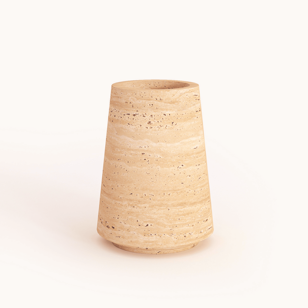 A Classic Beige Travertine Vase by Travertable, featuring a textured ceramic design with a wide base tapering slightly towards the top, set against a plain white background.