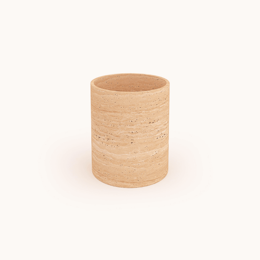 The Golden Sunrise Travertine Vase by Travertable features a cylindrical design with a smooth, speckled stone texture in natural beige, set against a plain white background.