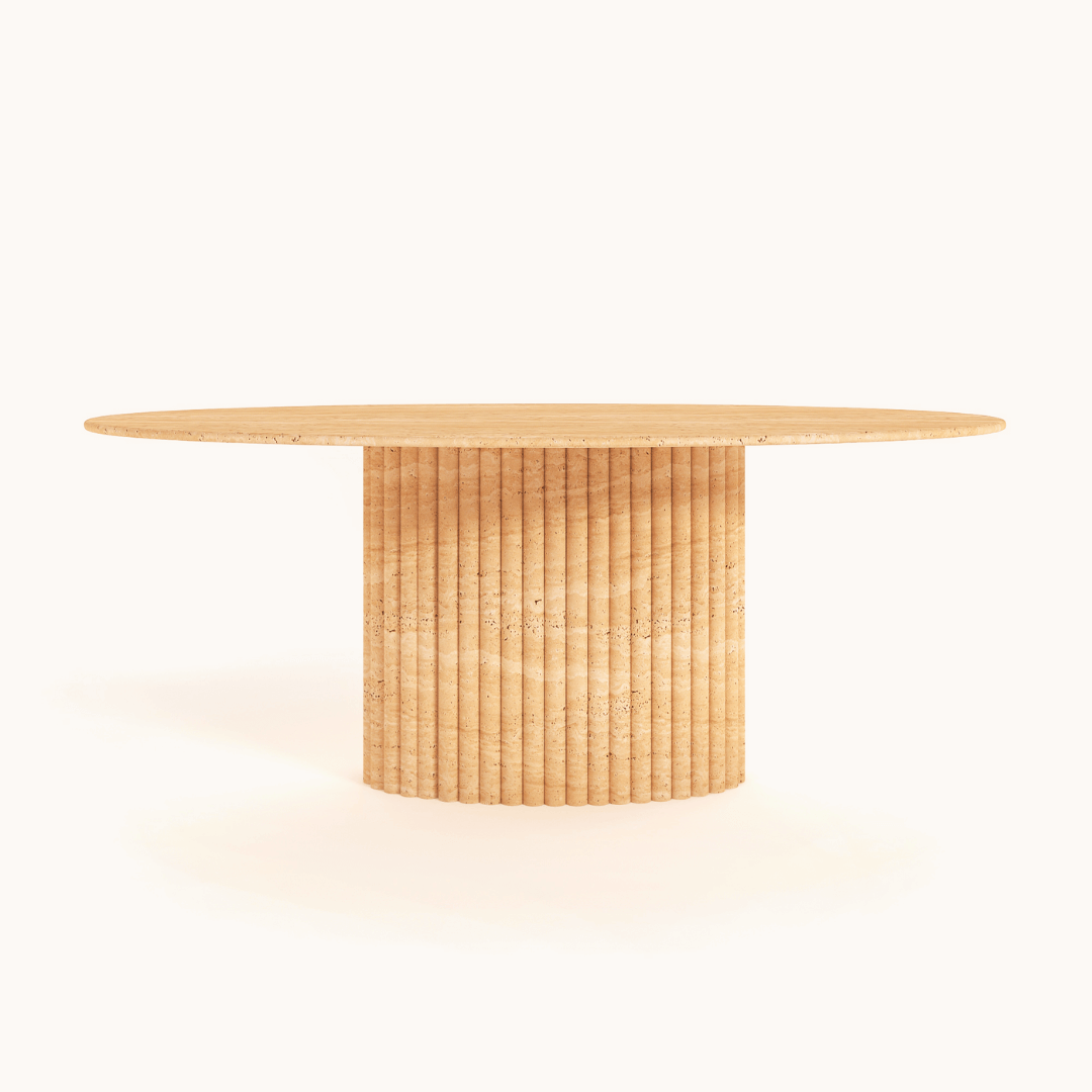 The Travertable Elysian Travertine Feast Table, featuring a round wooden design with a smooth top and ribbed pedestal base, elegantly stands against a plain white background.