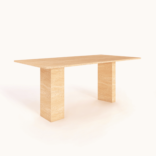 The Regal Rectangular Travertine Dining Table by Travertable embodies natural elegance with its minimalist beige design and two thick, flat legs. Perfect for sophisticated dining spaces, it stands out against a white background and offers customizable options.
