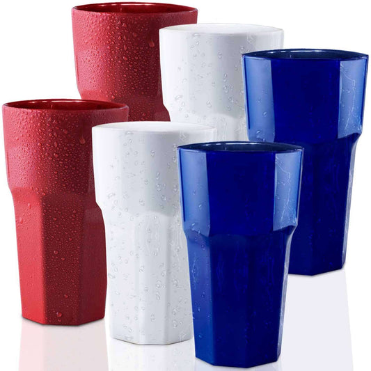 Mamaco Homes set of six unbreakable USA flag-themed tumblers form a patriotic display with two red, two white, and two blue glasses. The shatterproof, BPA-free design features faceted detailing and sparkling water droplets, perfect for 4th of July celebrations against a white backdrop.