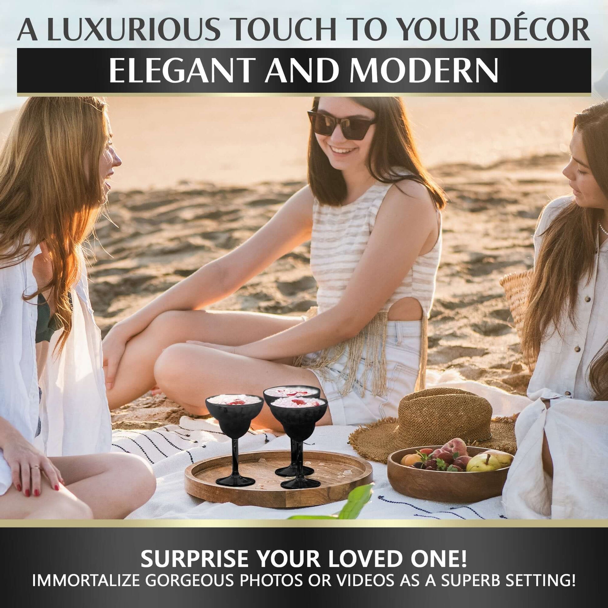 Three women enjoy a luxurious beach picnic at sunset with Mamaco Homes Unbreakable Margarita Glasses – 14oz Large Polycarbonate Drinkware, strawberries, and a round tray. Smiling in summer attire, they embody elegance and luxury. Ideal for surprising a loved one.