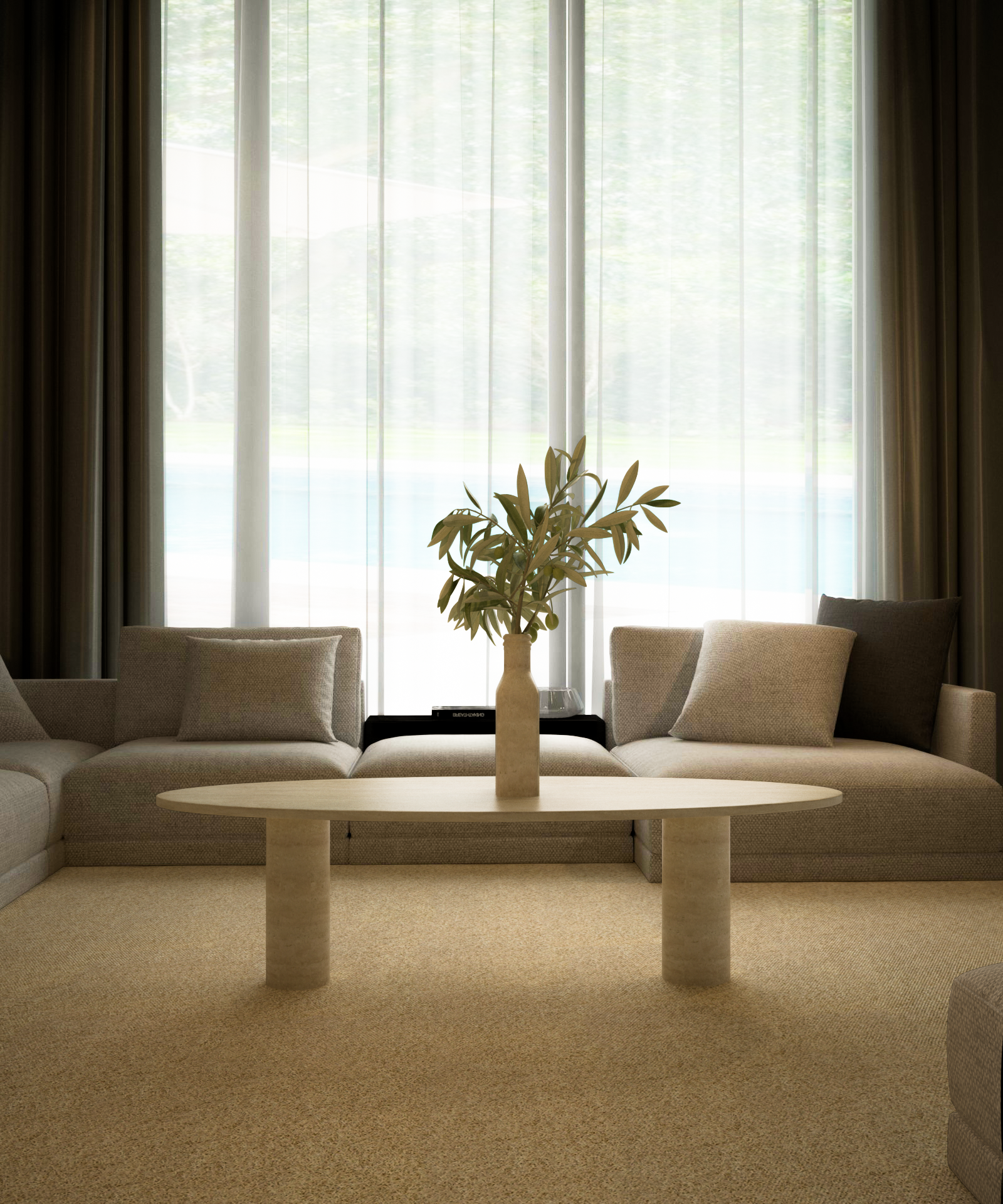 A minimalist living room features two beige sofas, TRAVERTABLEs Ellipse Travertine Coffee Table with a solid cylindrical base, a vase of greenery, and large windows with sheer curtains letting in natural light.