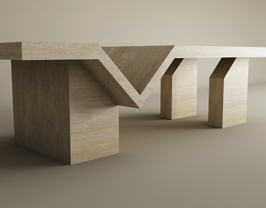 The Architectural Travertine Coffee Table by TRAVERTABLE features a sculptural four-leg base, a V-cutout geometric tabletop in smooth beige natural stone—timeless and customizable for any neutral space.