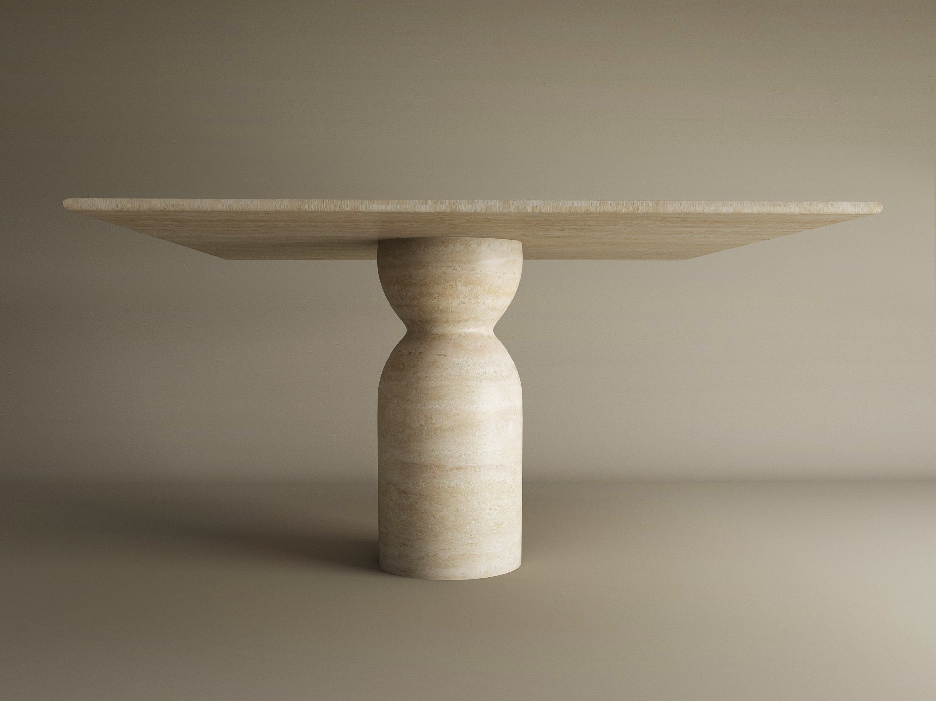 The TRAVERTABLE Square Travertine Dining Table features a sculptural round center base and an organic stone form, with a light beige finish and flat rectangular top—customizable to suit your dining space.