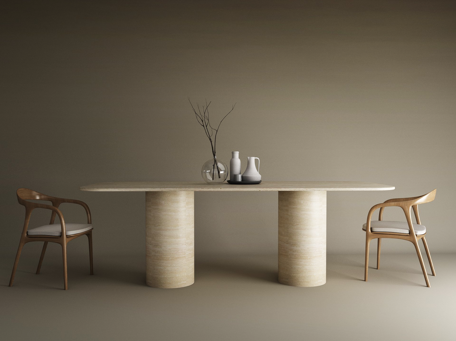 The TRAVERTABLE Rectangular Travertine Dining Table with Cylindrical Base sits between two wooden chairs with white cushions. On the natural stone surface are a clear vase with branches and three ceramic vessels, set against a plain brown wall.