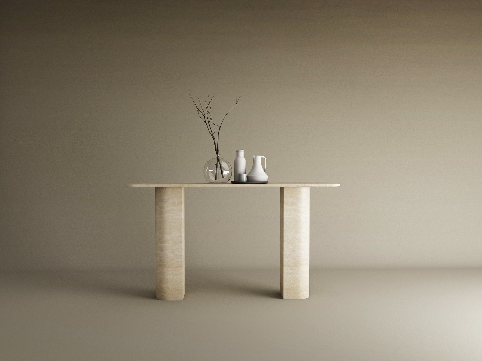 The TRAVERTABLE Rectangular Travertine Console Table with Sloped Pedestal Base in natural stone displays a glass vase with bare branches and two ceramic pitchers, set against a plain beige background.