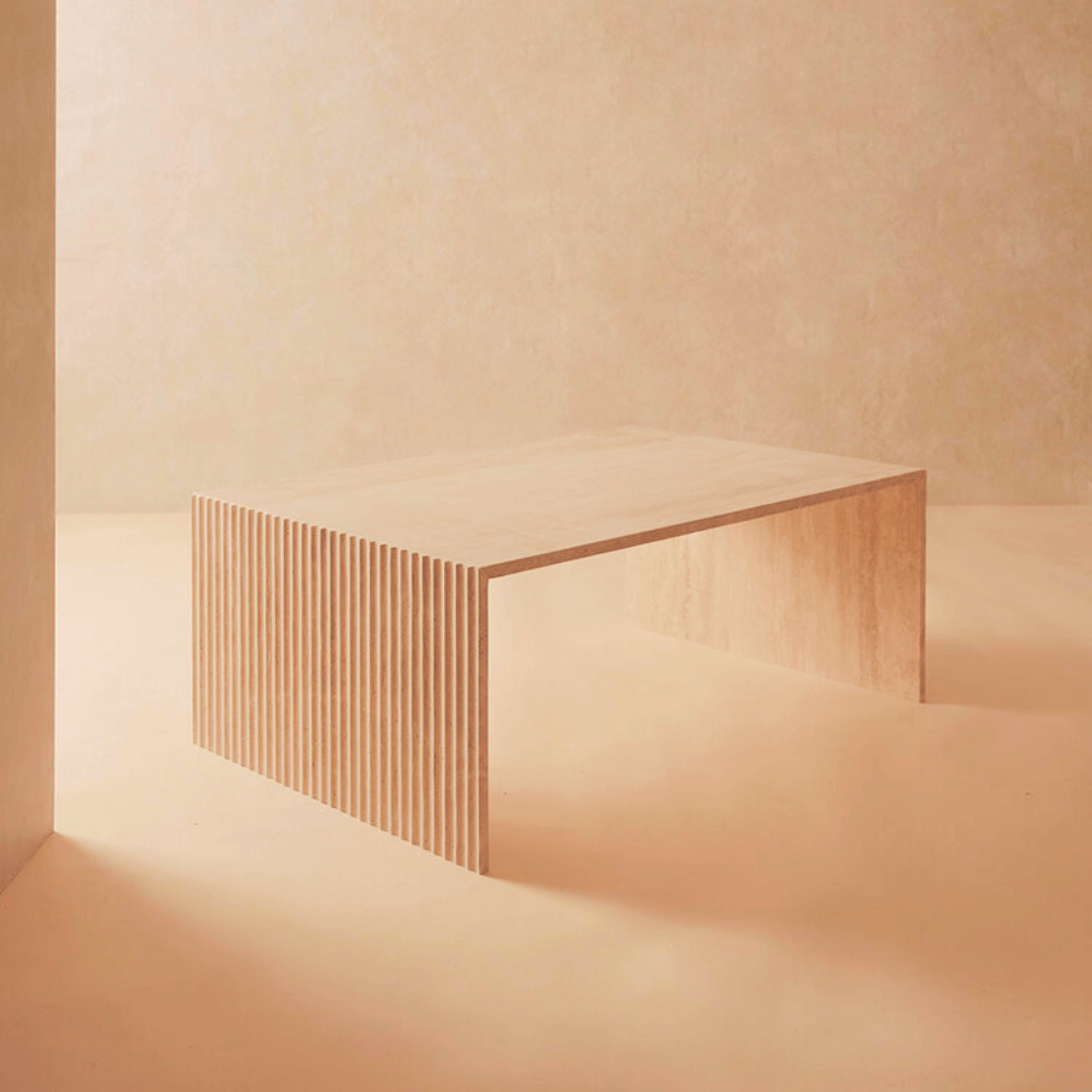 Side angle showcasing the customizable travertine coffee table's sturdy base and natural stone texture