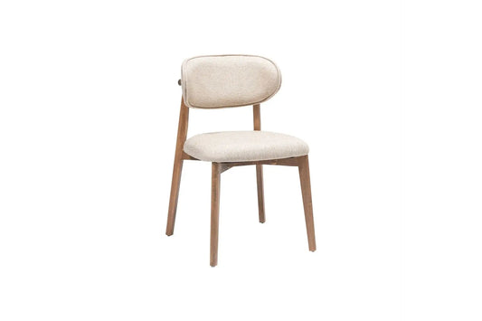 The Sleek Comfort Dining Chair by Travertable features a modern ergonomic design with a beige cushioned seat, slightly curved backrest, and wooden legs. Its minimalist style and smooth upholstery complement the natural wood finish, while the textured gray fabric adds sophistication.