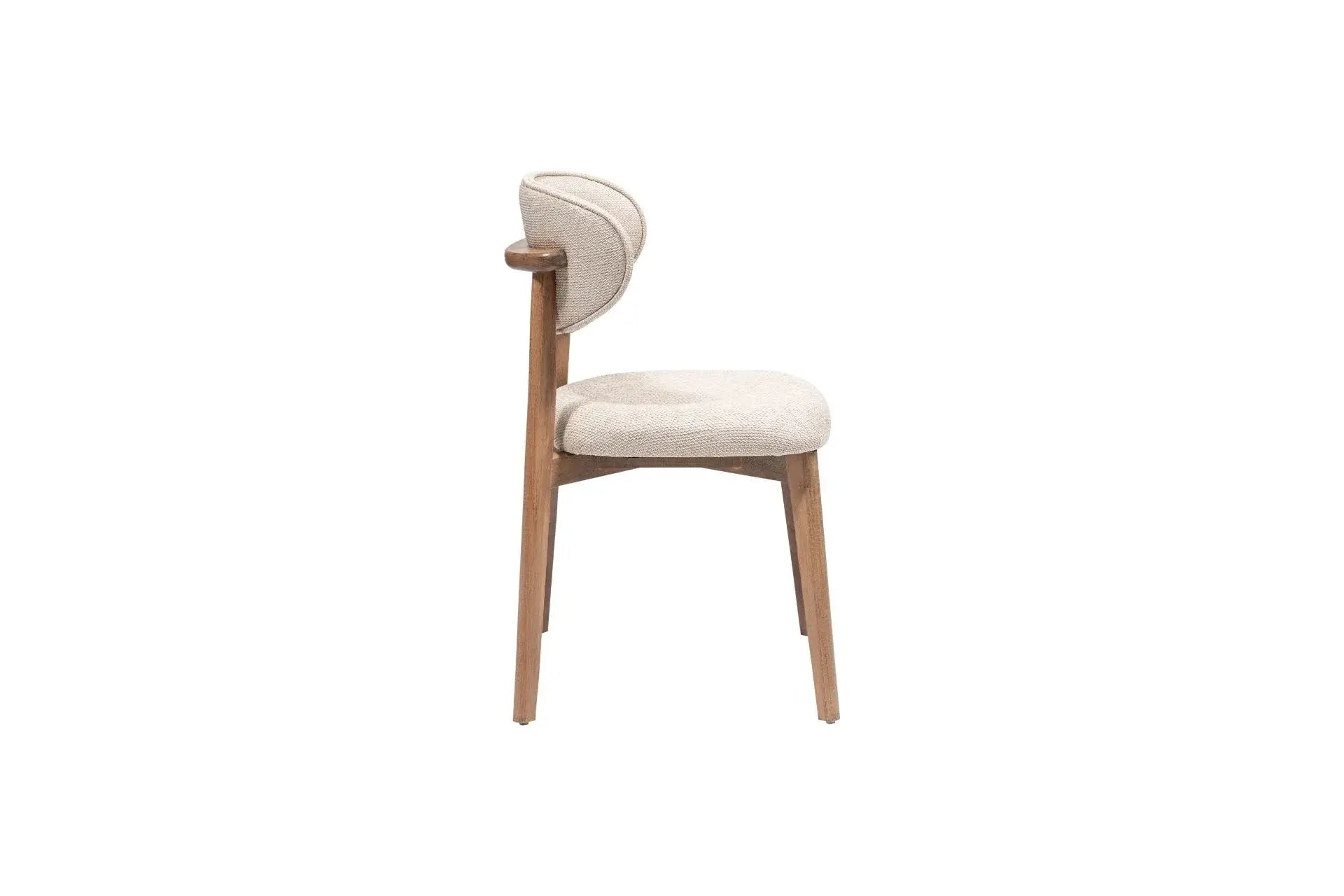 The Sleek Comfort Dining Chair by Travertable features a side view of a modern design with a light wooden frame and cushioned seat. Its ergonomic backrest has softly curved elements wrapped in textured gray fabric, enhancing its minimalist charm, set against a plain white background.