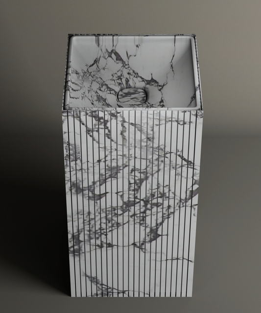 The TRAVERTABLE Calacatta Square Fluted Marble Pedestal Vanity Sink features gray-veined marble and vertical fluting, ideal for elevating any modern bathroom against a plain background.