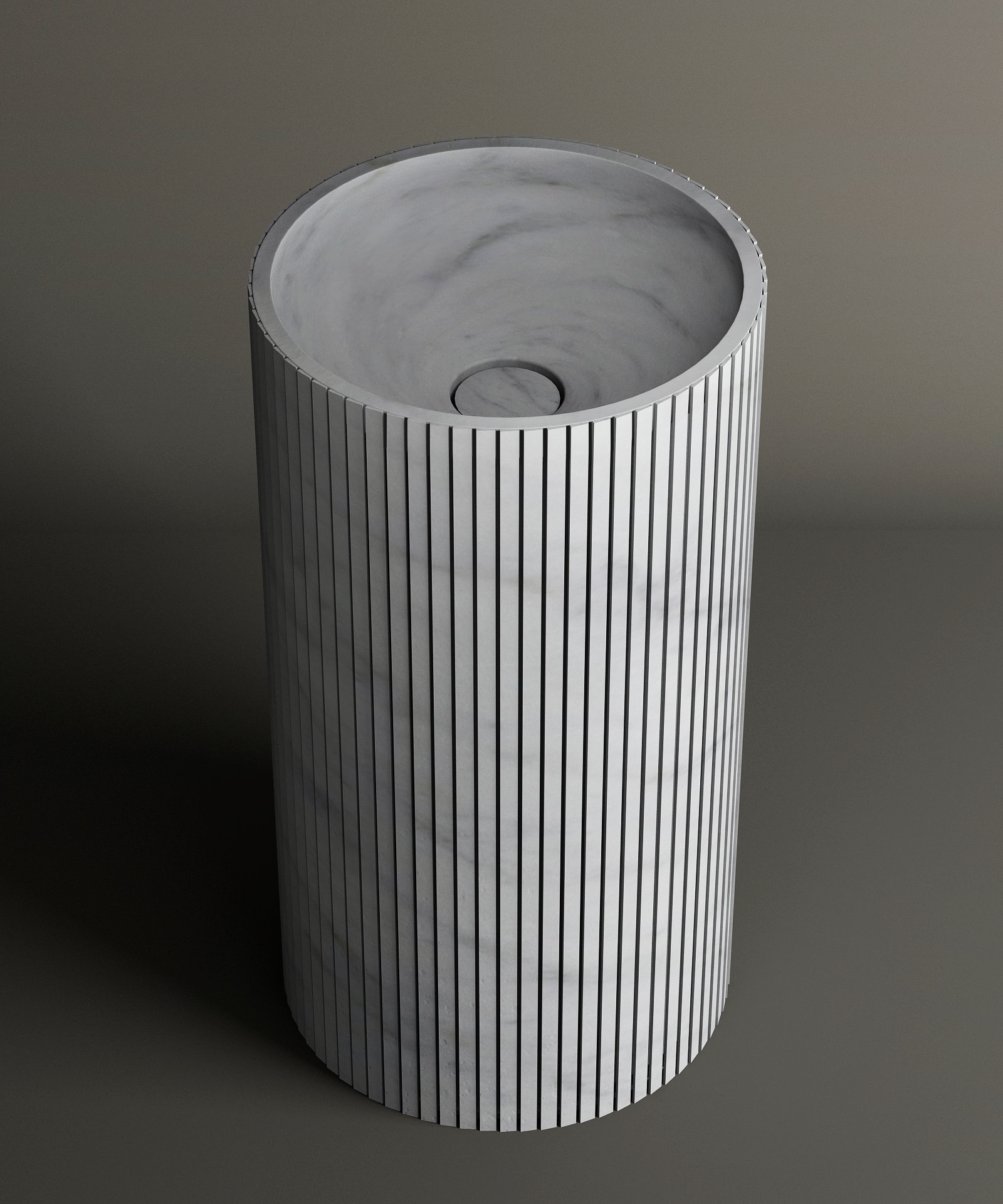 The TRAVERTABLE Carrara Round Fluted Marble Pedestal Vanity Sink features a cylindrical shape, fluted exterior, and smooth interior with a central drain, set against a plain background for a timeless look.