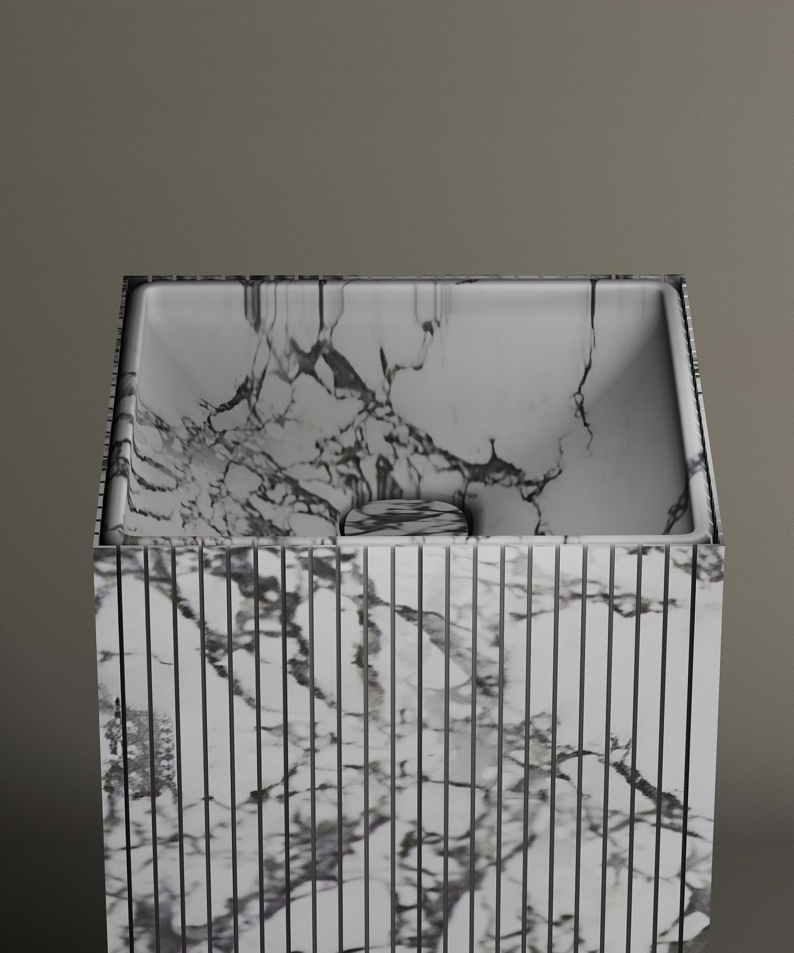 The TRAVERTABLE Calacatta Square Fluted Marble Pedestal Vanity Sink features striking black and white veining, a vertically grooved exterior, and a smooth interior, shown against a simple, neutral backdrop.